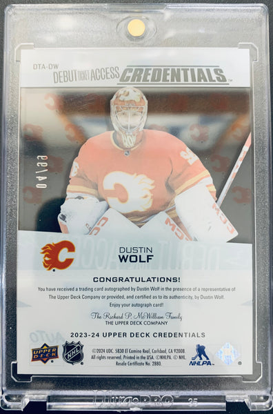 2023-24 UD CREDENTIALS HOCKEY #DTA-DW CALGARY FLAMES - DUSTIN WOLF ACETATE DEBUT TICKET ROOKIE AUTOGRAPH #D 04/99