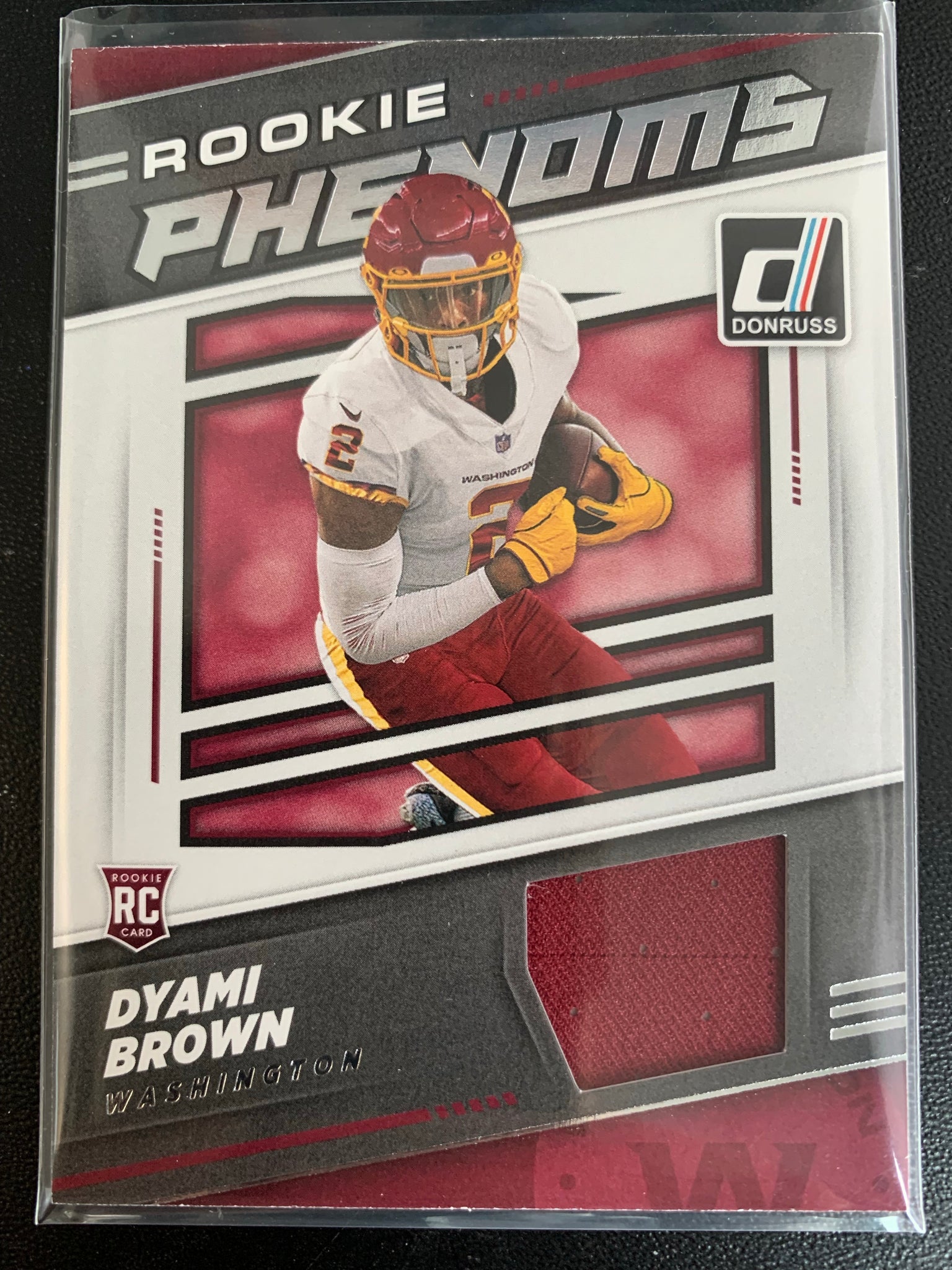 2021 PANINI DONRUSS FOOTBALL #RPJ-DBR WASHINGTON FOOTBALL TEAM - DYAMI BROWN ROOKIE PHENOMS JERSEY PATCH INSERT